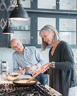 SwiftCapital Banking Senior 65+ Chequing Account Seniors cooking in kitchen