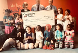 SwiftCapital helps communities playschool staff and kids accept cheque