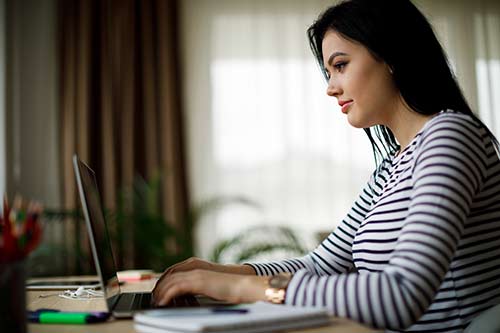 Personal Online Banking woman banks online at home